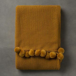 Beverly Ochre Strik Pom Pom Throw